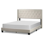 Lit en tissu beige avec capitonnage et ailes cloutées